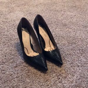 Black pointed toe pumps